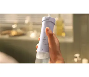Philips HX3333/23 purpurová / Ústna sprcha / nabíjacie / gombíkové ovládanie