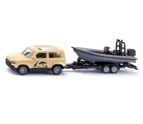 Siku Land Rover Defender Safari s člnom / Model auta / kov a plast / od 3 rokov